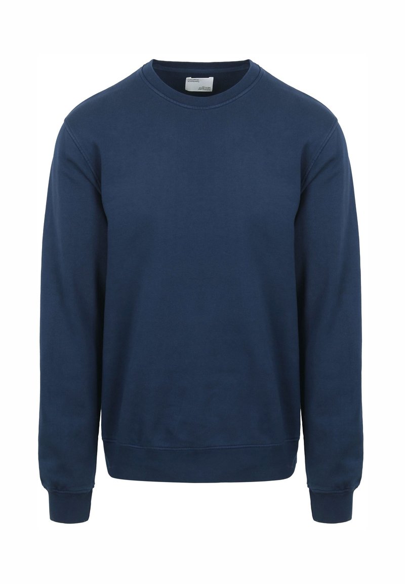 Marineblauwe sweatshirt van zacht katoen. Heeft een ronde hals, lange mouwen en ribgebreide manchetten en zoom. Eenvoudig ontwerp zonder patronen.