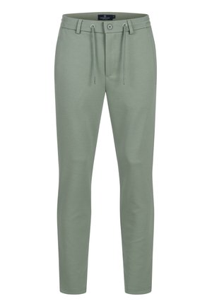 Pantaloni verde chiaro su misura con vita con bottone e coulisse, tasche laterali e tessuto strutturato.