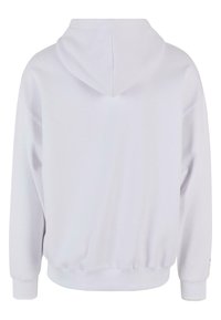 Witte hoodie met een relaxte pasvorm, geribbelde manchetten en zoom, en een zachte, gestructureerde stof. Bevat een grote capuchon aan de achterkant.
