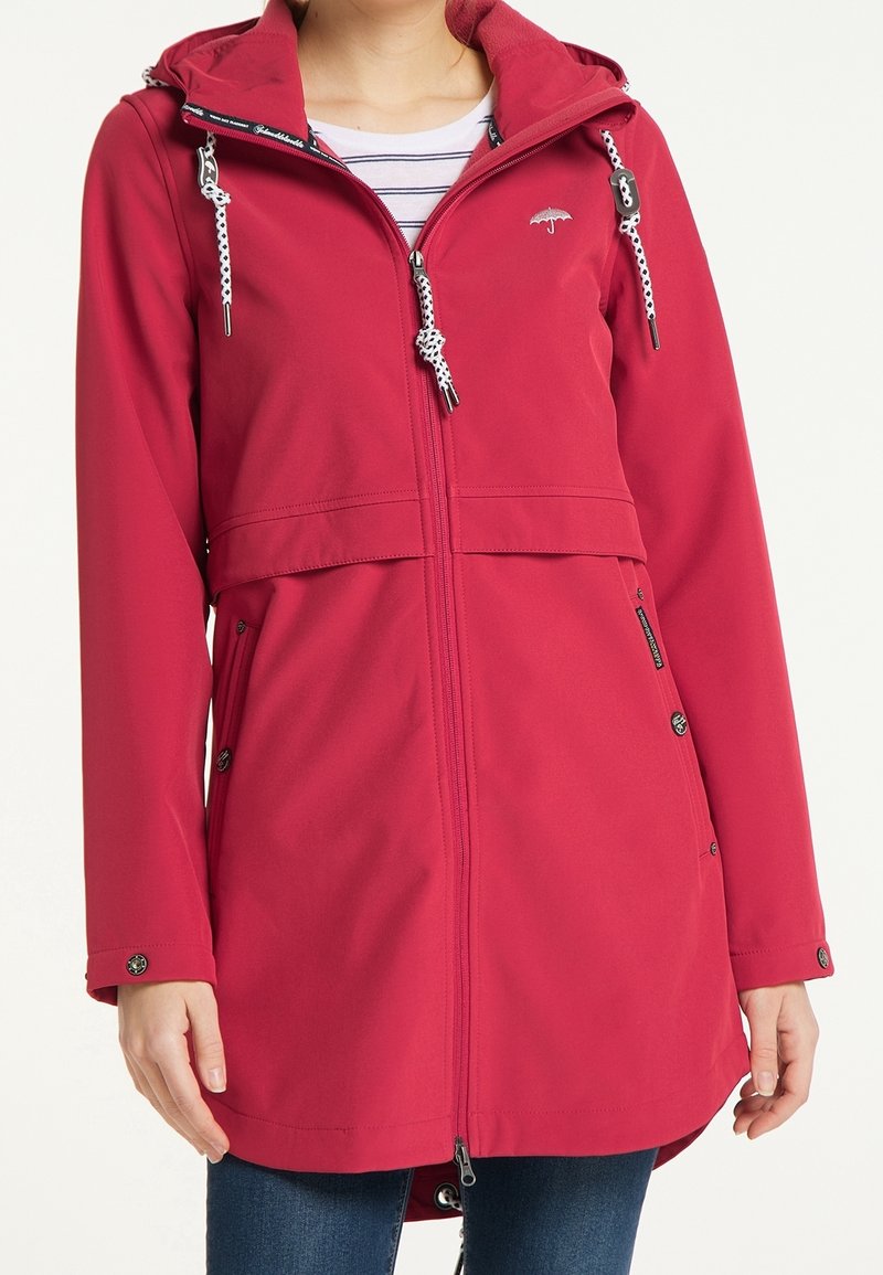Giacca con zip rossa con cappuccio, con dettagli in cordino bianco, tasche e una consistenza morbida. Sagomata con un taglio leggermente svasato.