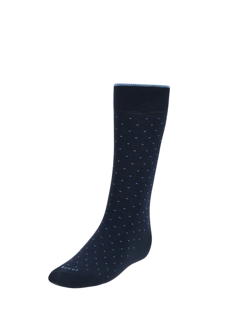 Marinblå strumpa av mjukt tyg med ribbat skaft. Har små blåa prickar över hela kroppen. Midja-längdsdesign.