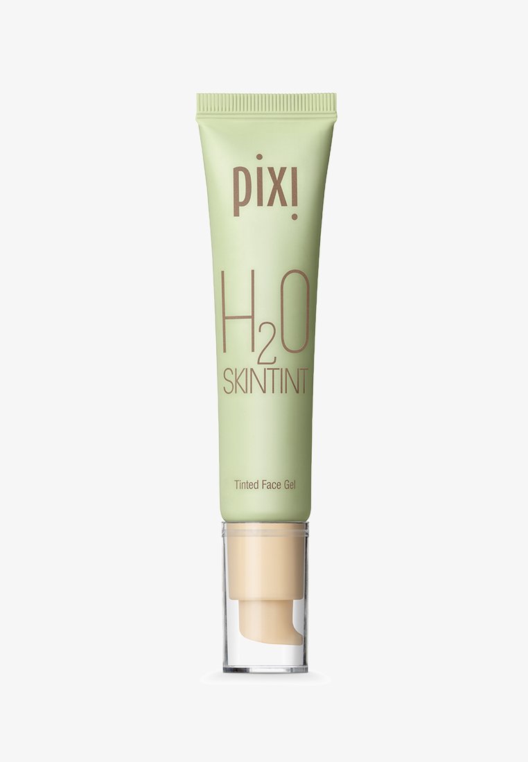 Tube de gel teinté pour le visage Pixi H2O Skintint avec un distributeur pompe beige sur fond blanc.
