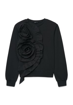 Sweat-shirt noir à manches longues avec une grande appliqué en tissu superposé en forme de rose sur le côté avant gauche.