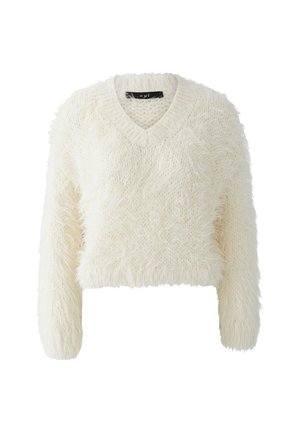 Cream-colored, fuzzy knit cropped sweater with long sleeves and a V-neck collar on a white background.
