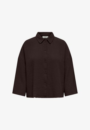 Sort cropped skjorte med et tekstureret stof. Har en knaplukning foran, spids krave og brede 3/4-dels ærmer.
