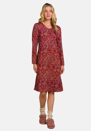 Long-sleeve dress in red with floral print, featuring a round neckline and a relaxed fit, paired with pink slippers and white knit socks.