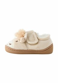 Ljusbeige toffel med plysch tyg, med en fluffig detalj, kardborreband och mjukt foder. Gummiyttersula för grepp och hållbarhet.