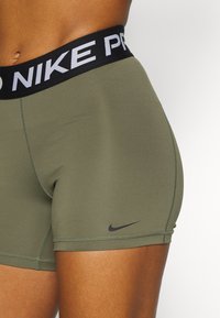Nike Performance SHORT - Leggings - medium olive/black