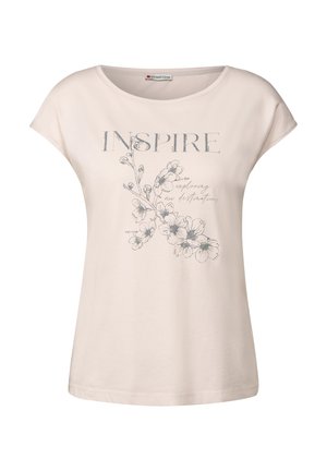 T-Shirt in cotone color beige chiaro con collo rotondo, maniche a cappuccio e stampa floreale. Il testo recita "ISPIRARE" in caratteri grassetto sopra delicate grafiche floreali.