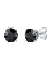 Orecchini a perno in pietra nera con design sfaccettato, montati in un metallo lucido di tonalità argento. Caratterizzati da un fissaggio sicuro con chiusura a farfalla.