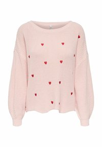 Pull en tricot rose clair avec manches longues amples et petits motifs de cœurs rouges dispersés sur le devant et les manches.