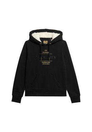 Black hoodie featuring a faux fur lining, a kangaroo pocket, and gold logo accents on the front. Regular fit with ribbed cuffs and hem.