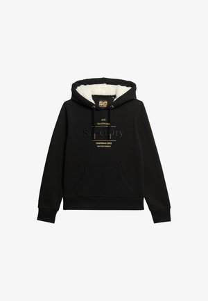 Zwarte hoodie met een nepbont voering, een buidelzak en gouden logo-accenten aan de voorkant. Gewone pasvorm met ribgebreide boorden en zoom.
