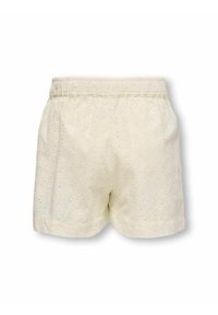 Bomuldsshorts i creme med blomsterbroderi og hulmønsterdetaljer. Har en elastisk talje og en afslappet pasform.