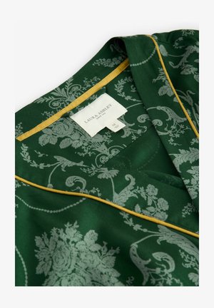 Green patterned fabric with delicate floral motifs, accented by a yellow trim at the collar. Label reads "Laura Ashley," size M.