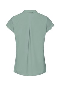 Blouse courte manches courtes vert sauge clair avec un pli dans le dos et un petit col.