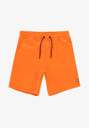 Oranje sportshorts gemaakt van zachte stof, met een trekkoord in de taille, twee zijzakken en een klein merklabel aan de onderkant links.