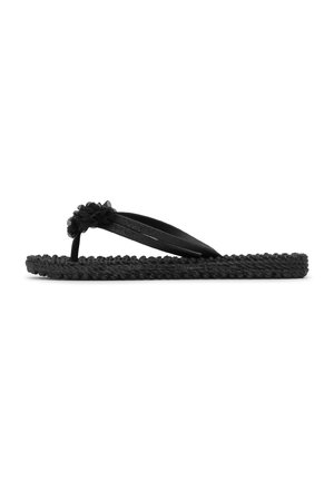 Black braided flip-flop sandal with fabric flower detail on toe strap, shown in side profile on white background.