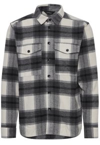 Zwart-wit geblokt flanellen shirt met een geruit patroon, knoopsluiting bij de kraag, twee borstzakken en zwarte knopen op een recht afgesneden zoom.