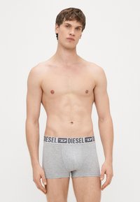 Hallid bokserpüksid pehmest kangast, lai must vöökoht logoga, lõikega, sileda pinnaga.