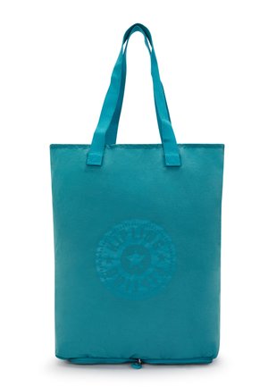 Teal tote bag with two long handles, made of a smooth material. Features a circular logo print centered at the bottom. Zipper closure at the base.