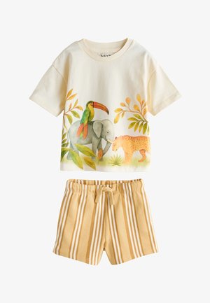 Kremowy t-shirt z krótkim rękawem z ilustracjami tukana, słonia i lamparta, zestawiony z żółtymi i białymi szortami w paski ze sznurkiem.