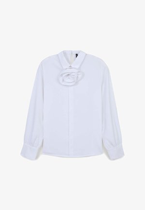 Weißes Langarmhemd mit hohem Kragen. Verfügt über ein strukturiertes, geschichtetes Rosendetail auf der Vorderseite. Mit Manschettenärmeln; glattes Material.