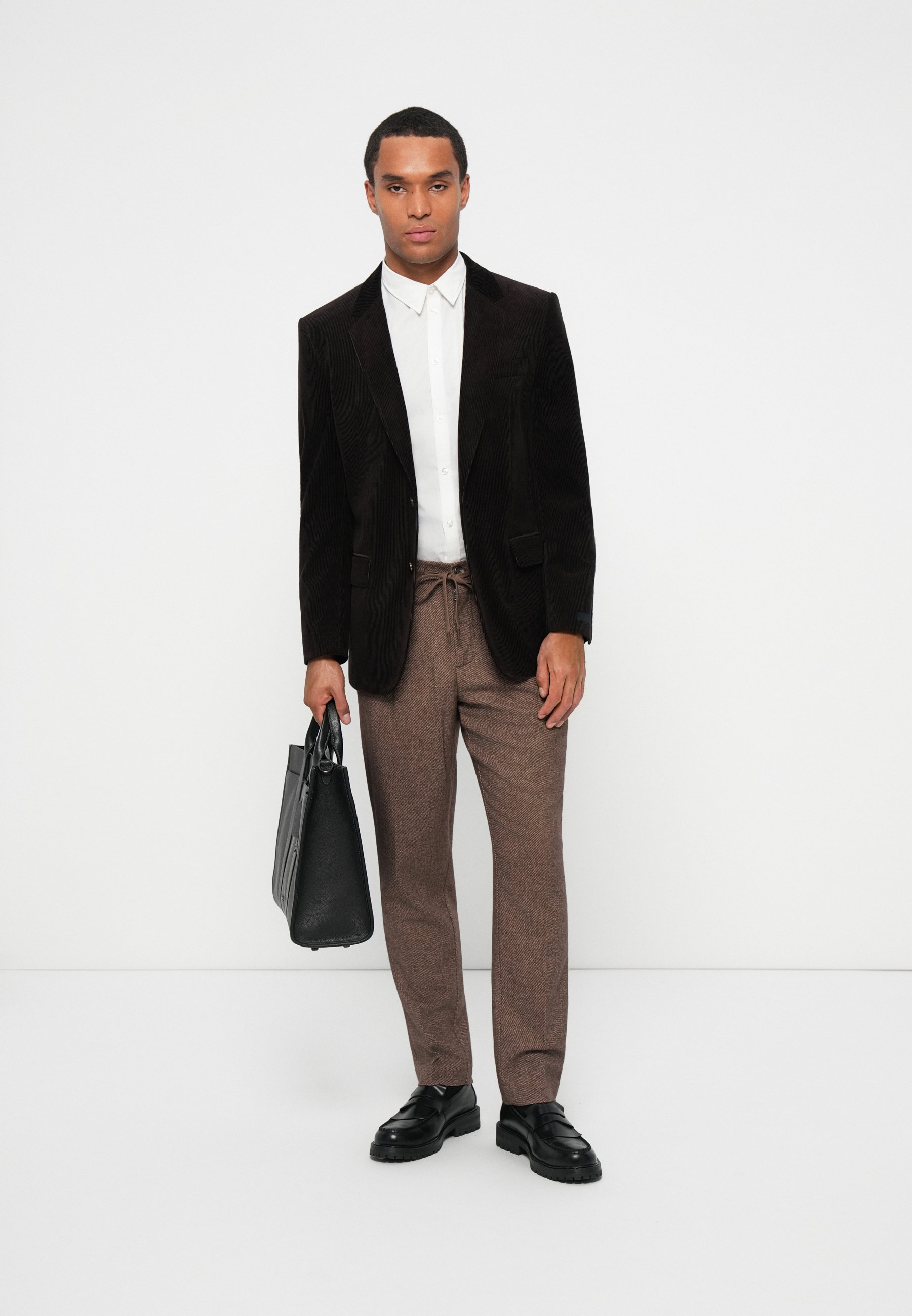 black blazer and brown shoes