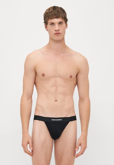 Schwarze Herren-Thong-Unterwäsche mit einem elastischen Bund und "DSQUARED2"-Logo, aus glattem Stoff, minimaler Abdeckung und einer figurbetonten Passform.