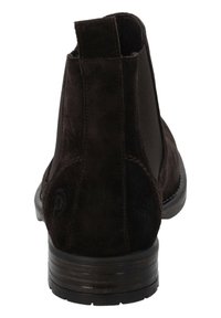 Bottines en daim marron avec des panneaux latéraux élastiques, un bout arrondi et un talon empilé. Présentent une texture douce et des détails de couture subtils.