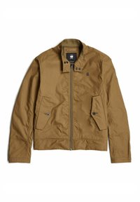 Brun zip-up jacka med ståkrage, sidofickor och en slät tygstruktur. Har tryckknappar och en logotyp på bröstet.