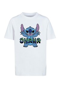 Valge puuvillane T-särk, millel on suurte kõrvadega ja avatud suuga sinine karikatuuritegelane, ümbritsetud sõnaga "OHANA" värvilistes tähtedes.