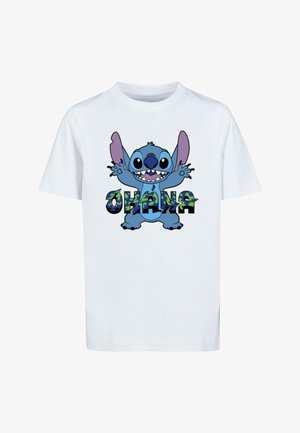 Hvid bomulds t-shirt med en blå tegneseriefigur med store ører og åben mund, omkranset af ordet "OHANA" i farverige bogstaver.