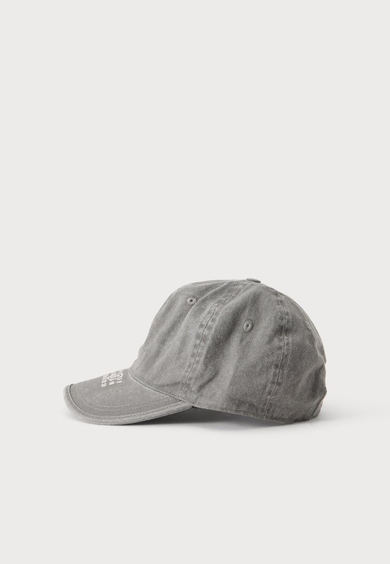 Gray cotton baseball cap with visible stitching and ventilation holes, placed on a plain light background.