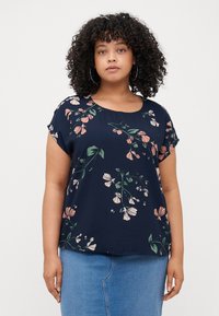 Navy blouse with short sleeves, featuring a floral pattern in pink and green. Smooth, lightweight fabric with a round neckline.