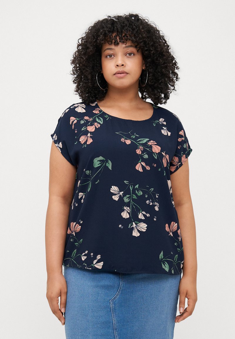 Navy blouse with short sleeves, featuring a floral pattern in pink and green. Smooth, lightweight fabric with a round neckline.