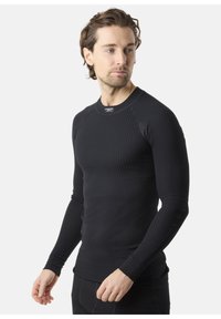 Zwarte thermoshirt met lange mouwen, voorzien van een geribbelde textuur, ronde hals en een aansluitend ontwerp, geschikt voor lagen of actieve kleding.