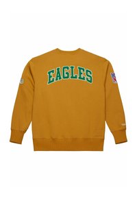 Felpa gialla senape con "EAGLES" in lettere verdi sul retro, patch del logo NFL sulla manica destra e polsini e fondo a costine.