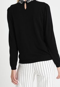 NAF NAF Stickad tröja - black