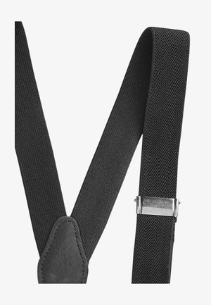 Schwarze Stoffträger mit Fischgrätenmuster, ausgestattet mit Lederakzenten und einem silbernen Metallclip zum Befestigen. Robustes und verstellbares Design.