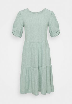 Mint green dress made of textured fabric, featuring a round neckline, puff sleeves, and a tiered skirt design.
