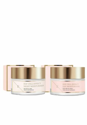Dwa słoiki nawilżaczy EGF Cell Effect, jeden oznaczony jako Nocny, drugi jako Dziennego, z złotymi pokrywkami i różowo-białymi pudełkami w tle.