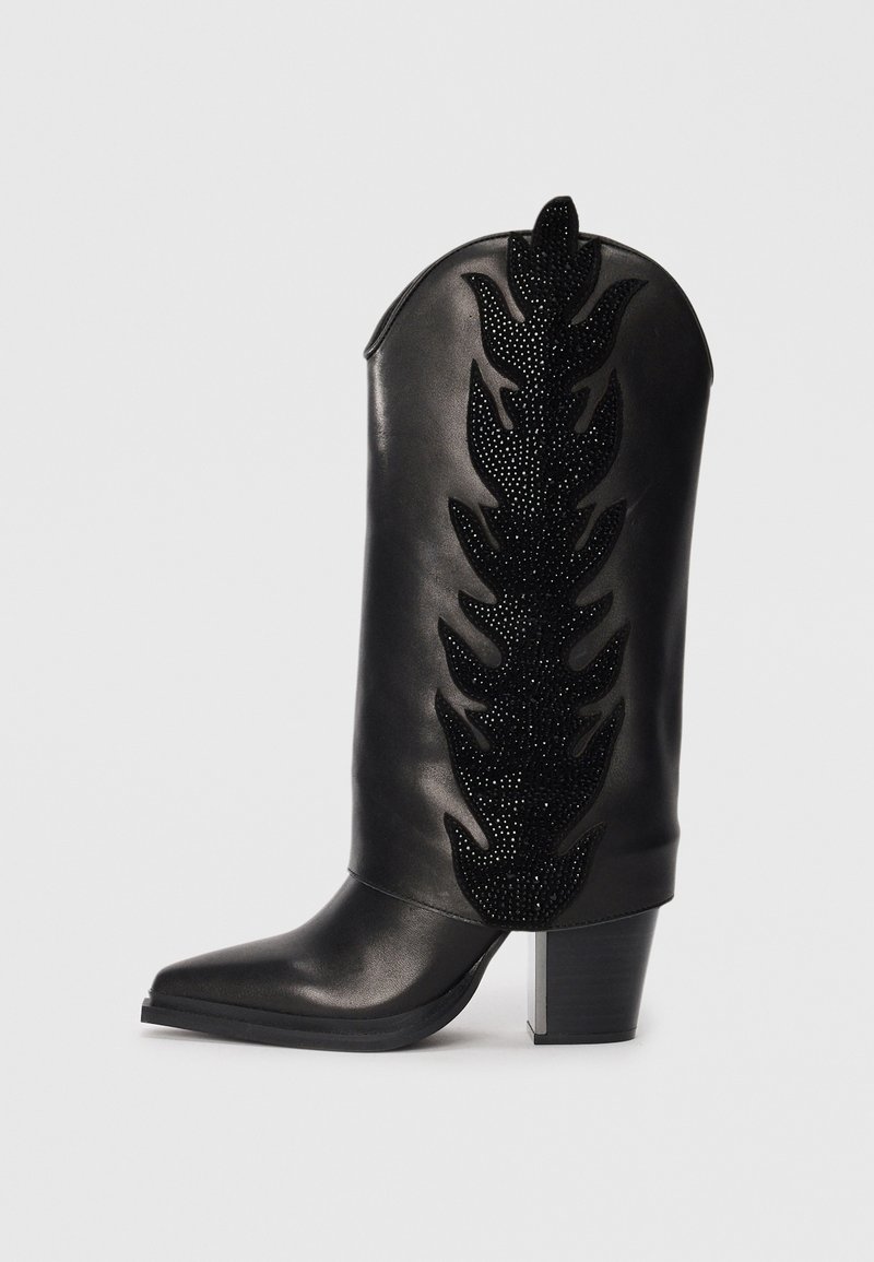 Black leather cowboy boot with a pointed toe, embellished with a leaf pattern in black rhinestones on the shaft. Chunky block heel.