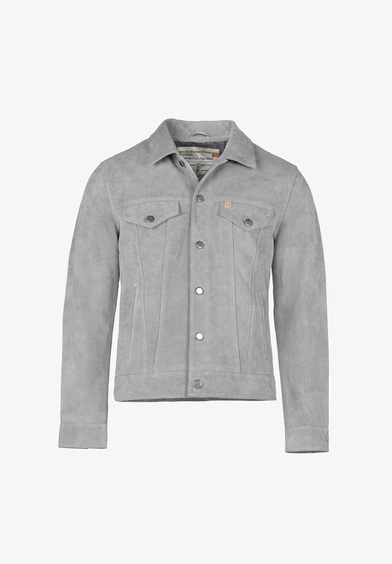 Halli seemisnahast jakk pikkade varrukatega, esitelgedega taskud ja metallist trukid. Sile tekstuur ja kohandatud lõige.