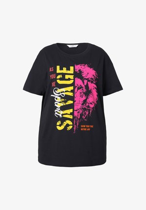 Black cotton t-shirt featuring a lion graphic in pink, yellow, and white text. “SAVAGE” and “SHOW YOUR TRUE NATURE” are prominently displayed.