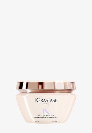 Masque capillaire Kérastase Paris Gloss Absolu dans un contenant rose pâle avec un couvercle en rose doré, 200 ml, vue de face.