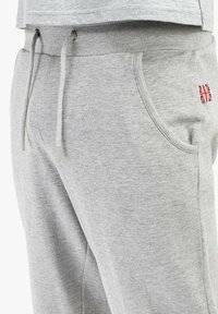 Gray cotton blend sweatpants with side pockets, elastic waistband, and drawstring. Features a small Union Jack flag patch on the side.