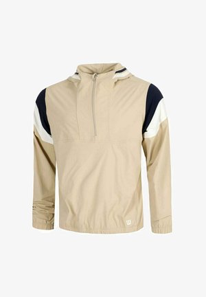 Veste-pull beige avec demi-fermeture éclair, poignets élastiques et accents bicolores noir et blanc sur les épaules et le haut des manches.