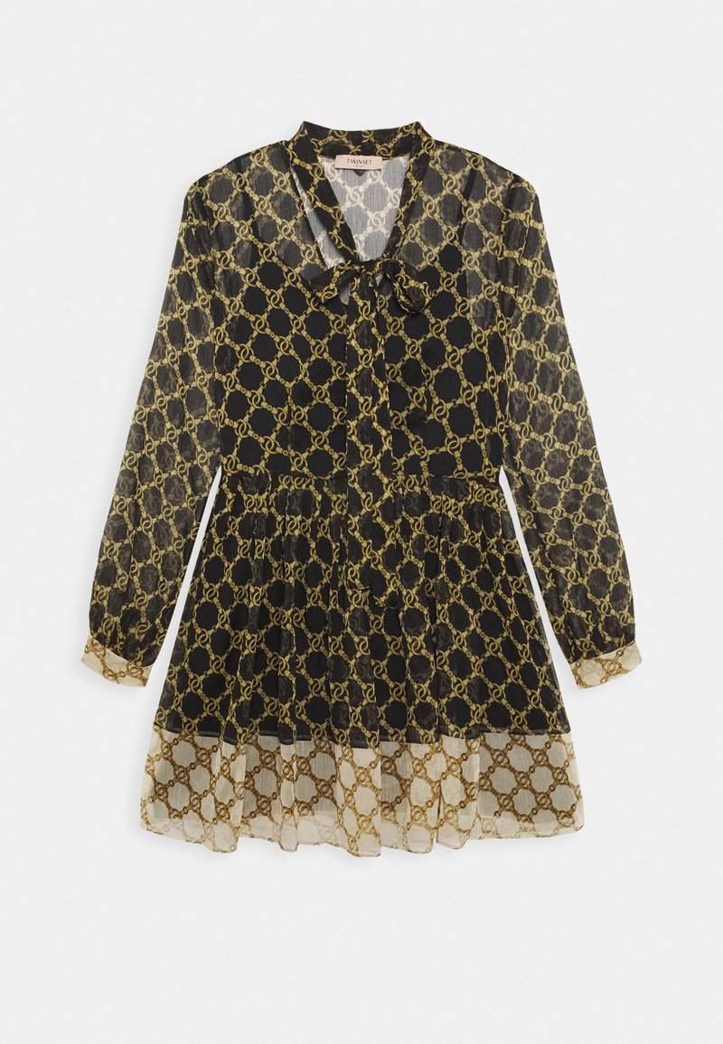 Robe noire transparente avec motif de chaîne dorée, col à revers et lien en ruban. Manches longues avec poignets froncés et détail d'ourlet superposé.