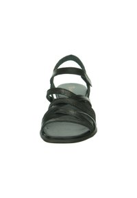 Schwarze Ledersandale mit mehreren über Kreuz verlaufenden Riemen, flacher Sohle und minimalistischer Gestaltung. Glatte Textur und offener Zehenbereich für Atmungsaktivität.